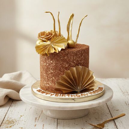 Gold themed chocolate birthday cake
